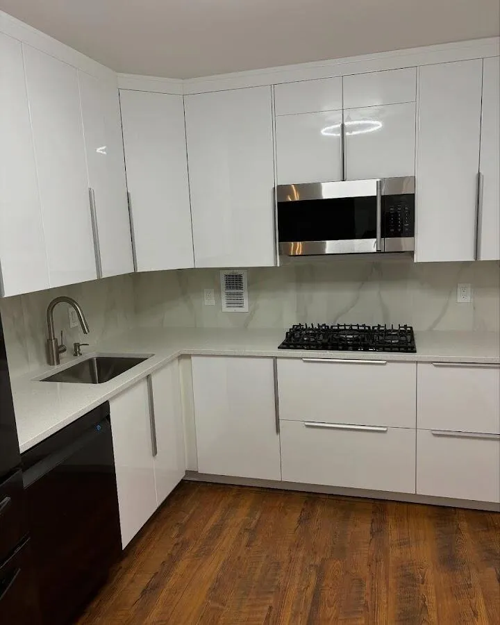 Restored kitchen with white cabinets after water damage in Forestville